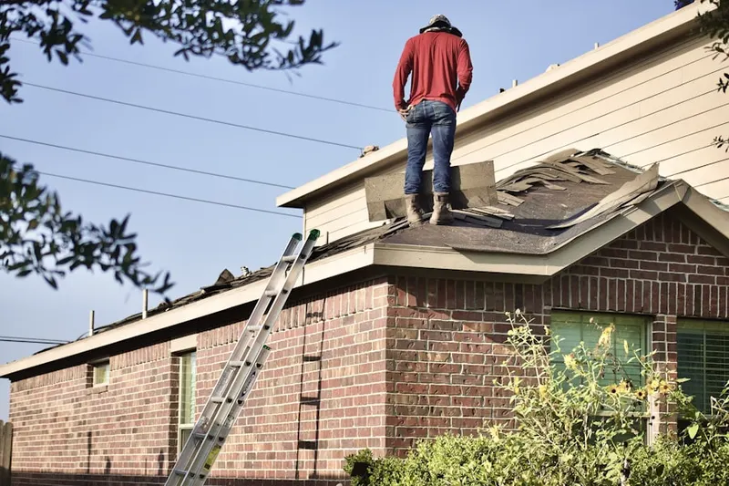 Professional roofer working on a residential roof in Downtown San Antonio